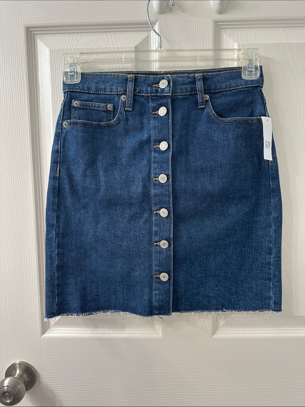NWT GAP Denim Button front mini skirt with raw hem bottom. Size 2